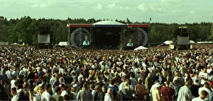 Images Dated 10th August 1996: Oasis pop group take the stage at Knebworth watched by 250, 000 fans over two days