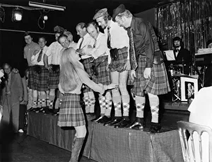 Off with their trousers! A line-up of phoney Scots in the Caledonian Suite night club Off with their trousers! A line-up of phoney Scots in the Caledonian Suite night club