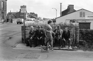 Old boys watch the girls go by from the bench at the junction of Keighly Road, Silsden Old boys watch the girls go by from the bench at the junction of Keighly Road, Silsden