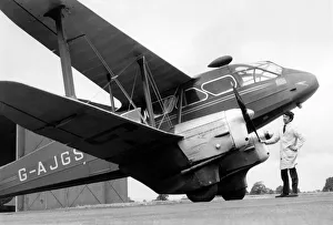 The old dragon prepares for its greatest test. Dragon Rapide G-AJGS being prepared for The old dragon prepares for its greatest test. Dragon Rapide G-AJGS being prepared for