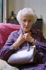 Old Lady holding her handbag Old Lady Sitting in A Chair Old Lady holding her handbag Old Lady Sitting in A Chair