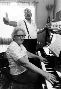 Old People - Jimmy Wallace sings away as he is accompanied by his wife Old People - Jimmy Wallace sings away as he is accompanied by his wife