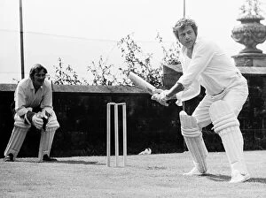 Images Dated 1st August 1974: Oliver Reed actor at batting practice for a challenge match in the grounds of his home at