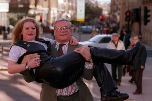 Oliver Reed actor star of film The Bruce lifting young blonde woman Karen Bruce in his Oliver Reed actor star of film The Bruce lifting young blonde woman Karen Bruce in his