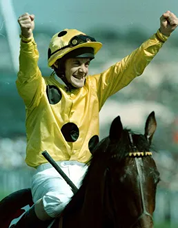 Olivier Peslier Jockey celebrates after winning the Derby on High Rise Racehorse as he is Olivier Peslier Jockey celebrates after winning the Derby on High Rise Racehorse as he is