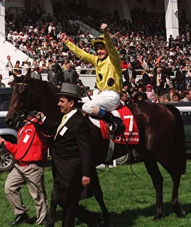 Olivier Peslier Jockey celebrates after winning the race on High Rise Racehorse as he is Olivier Peslier Jockey celebrates after winning the race on High Rise Racehorse as he is