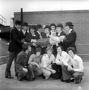 The Osmond Brothers pop group pose with body guards dressed as city gents with bowler The Osmond Brothers pop group pose with body guards dressed as city gents with bowler