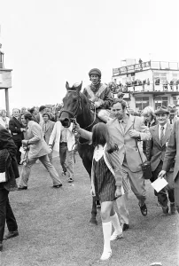 Owner Frank Spencer leads in Fiery Coin and jockey Cliffe Parkes after winning the Andy Owner Frank Spencer leads in Fiery Coin and jockey Cliffe Parkes after winning the Andy