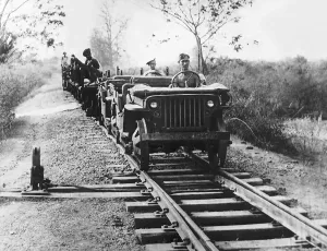A pair of Willys Jeeps adapted for running on railway tracks head southwards A pair of Willys Jeeps adapted for running on railway tracks head southwards