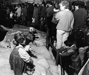Parents and children queue to see Santa in his grotto at Blackers store in Liverpool Parents and children queue to see Santa in his grotto at Blackers store in Liverpool