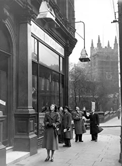 Passers-by looking up at the gas heaters outside the Northern Gas Board showrooms in Passers-by looking up at the gas heaters outside the Northern Gas Board showrooms in