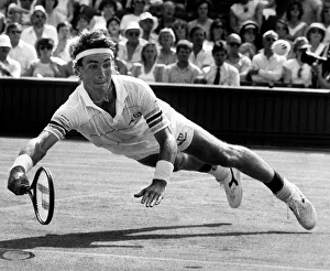 Pat Cash dives for the ball during the match against Mats Wilander Pat Cash dives for the ball during the match against Mats Wilander