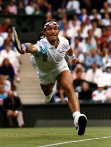 Pat Cash Tennis Player stretches for a return during his match against Jacco Eltingh Pat Cash Tennis Player stretches for a return during his match against Jacco Eltingh