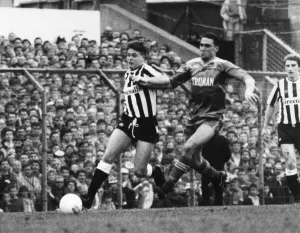 Paul Gascoigne, on the ball for Newcastle United, is chased by Wimbledon player Vinnie Paul Gascoigne, on the ball for Newcastle United, is chased by Wimbledon player Vinnie