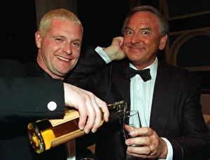 Paul Gascoigne gives Bob Monkhouse pours from bottle glass whisky Ibrox last night Paul Gascoigne gives Bob Monkhouse pours from bottle glass whisky Ibrox last night