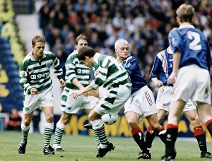 Paul Gascoigne of Rangers challenges Tosh McKinlay of Celtic in the Scottish Premier Paul Gascoigne of Rangers challenges Tosh McKinlay of Celtic in the Scottish Premier