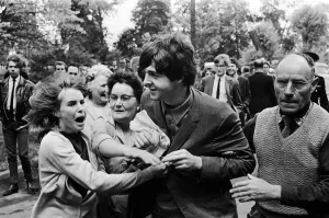 Paul McCartney of The Beatles is escorted past waiting fans as he arrives at ABC Studios Paul McCartney of The Beatles is escorted past waiting fans as he arrives at ABC Studios