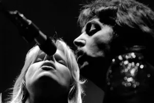 Paul McCartney, formerly of The Beatles, singing with his wife Linda as part of their Paul McCartney, formerly of The Beatles, singing with his wife Linda as part of their