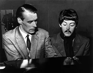 Paul McCartney playing the piano with producer George Martin, circa November 1966 Paul McCartney playing the piano with producer George Martin, circa November 1966