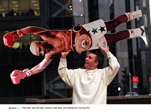 Paul Weir boxer holds cardboard cut out of Baby Jake Matlala who he will fight in a Paul Weir boxer holds cardboard cut out of Baby Jake Matlala who he will fight in a