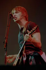 Paul Weller playing guitar and singing at T in the Park at Balado Airfield near Kinross Paul Weller playing guitar and singing at T in the Park at Balado Airfield near Kinross