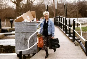 Paula Yates TV Presenter Walking over bridge with holding typewriter Paula Yates TV Presenter Walking over bridge with holding typewriter