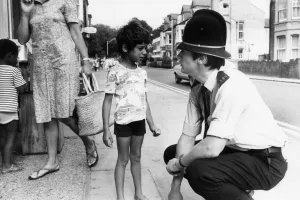 PC Nigel Barber speaks with a young boy, during patrol pod the streets of Cambridge PC Nigel Barber speaks with a young boy, during patrol pod the streets of Cambridge