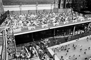 People enjoying the hot weather at the Oasis outdoor swimming pool Lido, London People enjoying the hot weather at the Oasis outdoor swimming pool Lido, London