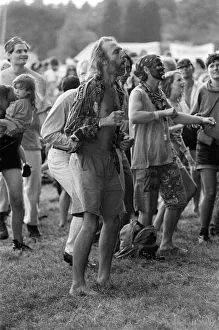 People enjoying the music at the WOMAD festival at Rivermead in Reading, Berkshire People enjoying the music at the WOMAD festival at Rivermead in Reading, Berkshire