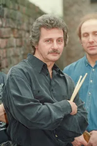 Pete Best, (in the black shirt holding his drum sticks) posing for the camera with his Pete Best, (in the black shirt holding his drum sticks) posing for the camera with his