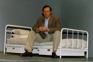 Peter Davison Actor in the Last Yankee sitting on a bed Peter Davison Actor in the Last Yankee sitting on a bed
