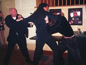 Peter Hook and Matt Bowers are kept apart by Leroy Richardson at " Peter Hook and Matt Bowers are kept apart by Leroy Richardson at "