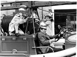 Peter Phillips takes over the driving of the vintage 1939 fire engine with Prince William Peter Phillips takes over the driving of the vintage 1939 fire engine with Prince William