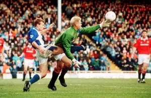 Peter Schmeichel Manchester United goalkeeper in a tangle with Alan Shearer of Blackburn Peter Schmeichel Manchester United goalkeeper in a tangle with Alan Shearer of Blackburn