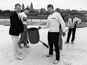 Phil Carrick Yorkshire skipper along with Sussex captain Paul Parker help with clearing Phil Carrick Yorkshire skipper along with Sussex captain Paul Parker help with clearing