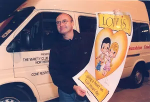 Phil Collins hands over a new Variety Club mini bus to CCNE Respite 10 November 1997 Phil Collins hands over a new Variety Club mini bus to CCNE Respite 10 November 1997