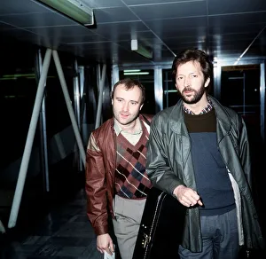 Phil Collins Singer Songwriter Actor with Eric Clapton leaving London Airport for Phil Collins Singer Songwriter Actor with Eric Clapton leaving London Airport for