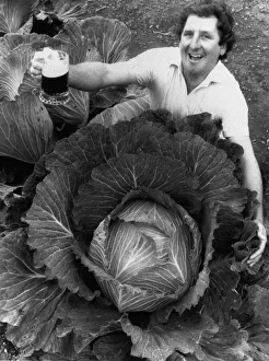 Phil Vowles with a cabbage which he watered with beer 1986 Phil Vowles with a cabbage which he watered with beer 1986