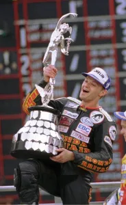 Phillip McCallen Motorcycle Racing TT Hat Trick Winner holds the TT Trophy which is 90 Phillip McCallen Motorcycle Racing TT Hat Trick Winner holds the TT Trophy which is 90