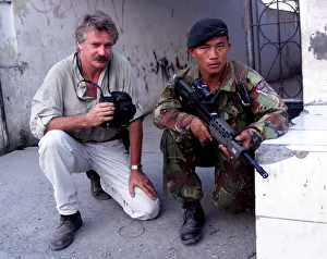 Photographer Mike Moore with Gurkha soldier on patrol in Dilli Photographer Mike Moore with Gurkha soldier on patrol in Dilli
