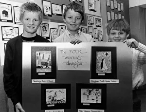 Pictured with the four winning designs in a Christmas card competition at Brunner Pictured with the four winning designs in a Christmas card competition at Brunner