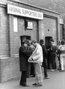 Police checking a fan's jacket outside Highbury. 5th March 1990 Police checking a fan's jacket outside Highbury. 5th March 1990