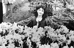Pop singer Kate Bush poses in a garden full of daffodils, Tuesday 17th April 1979 Pop singer Kate Bush poses in a garden full of daffodils, Tuesday 17th April 1979