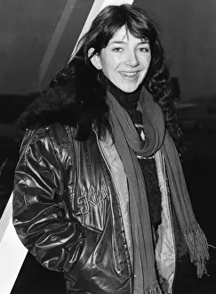 Pop singer Kate Busharriving at London Airport wearing a leather jacket with fur collar Pop singer Kate Busharriving at London Airport wearing a leather jacket with fur collar