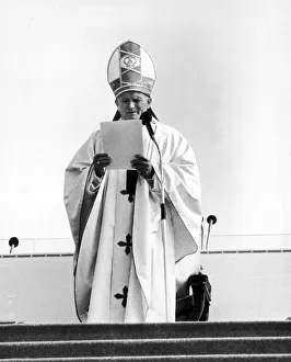Pope John Paul II reads his address from podium during Mass at Heaton Park, Manchester Pope John Paul II reads his address from podium during Mass at Heaton Park, Manchester
