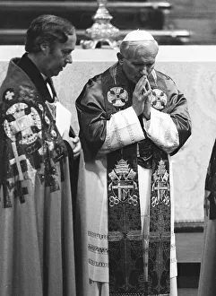 Pope John Paul II during his visit to Britain in 1982 in pray at the altar during a Pope John Paul II during his visit to Britain in 1982 in pray at the altar during a