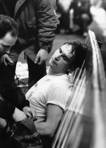 Portsmouth goalkeeper Alan Knight (centre) is injured after a clash with John Fashanu of Portsmouth goalkeeper Alan Knight (centre) is injured after a clash with John Fashanu of