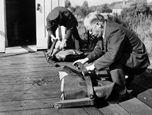 Post Office workers prepare the fitted pouches ready for the quick-release nets so Post Office workers prepare the fitted pouches ready for the quick-release nets so
