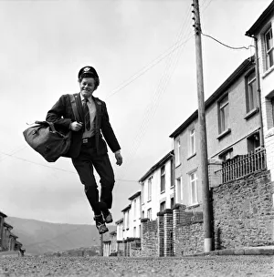 Postman Mr. Fred Henderson in happy mood as he delivers his mail. April 1975 Postman Mr. Fred Henderson in happy mood as he delivers his mail. April 1975
