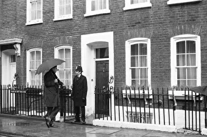 Press photographer chats with the police constable standing guard at the door to Harold Press photographer chats with the police constable standing guard at the door to Harold